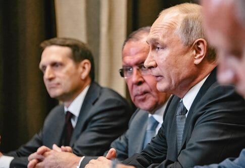Group of government officials engaged in a serious discussion during a meeting