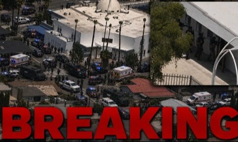 Aerial view of a large police presence at a scene marked as breaking news